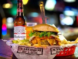 Burger and Budweiser beer at The Warehouse Bar & Grille Savannah